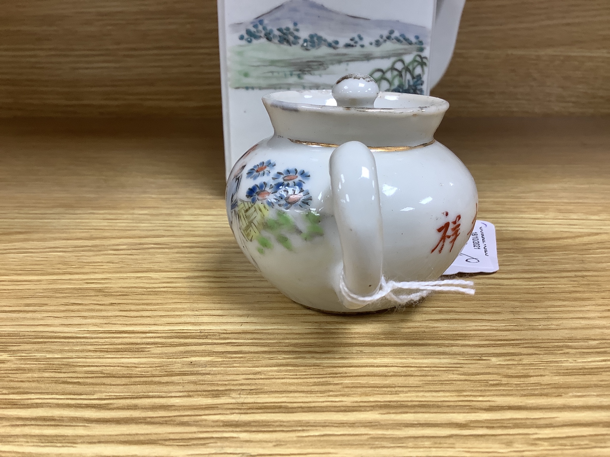 A Chinese enamelled porcelain square teapot and cover and a similar miniature teapot and cover, tallest 13cm